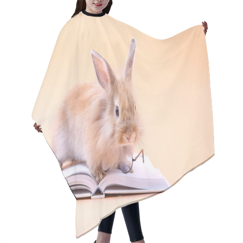 Personality  Cute Rabbit Sitting On A White Book With Glasses Placed. Easter Holiday Hair Cutting Cape