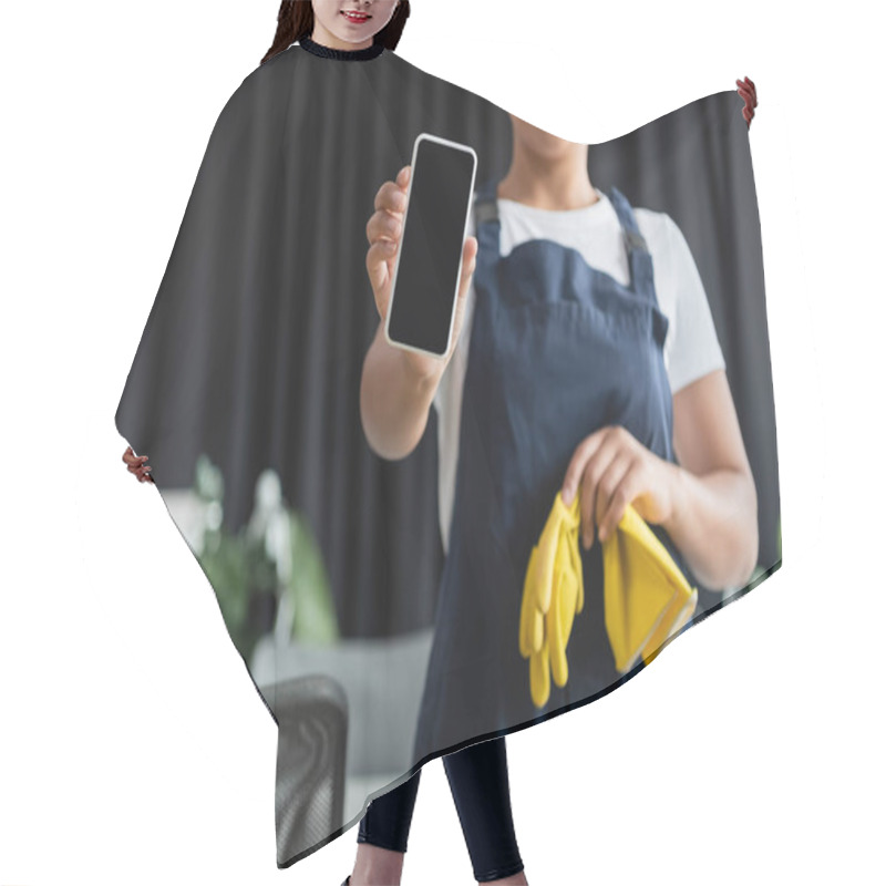 Personality  Cropped View Of Smiling Bi-racial Woman Holding Rubber Gloves And Smartphone With Blank Screen Hair Cutting Cape