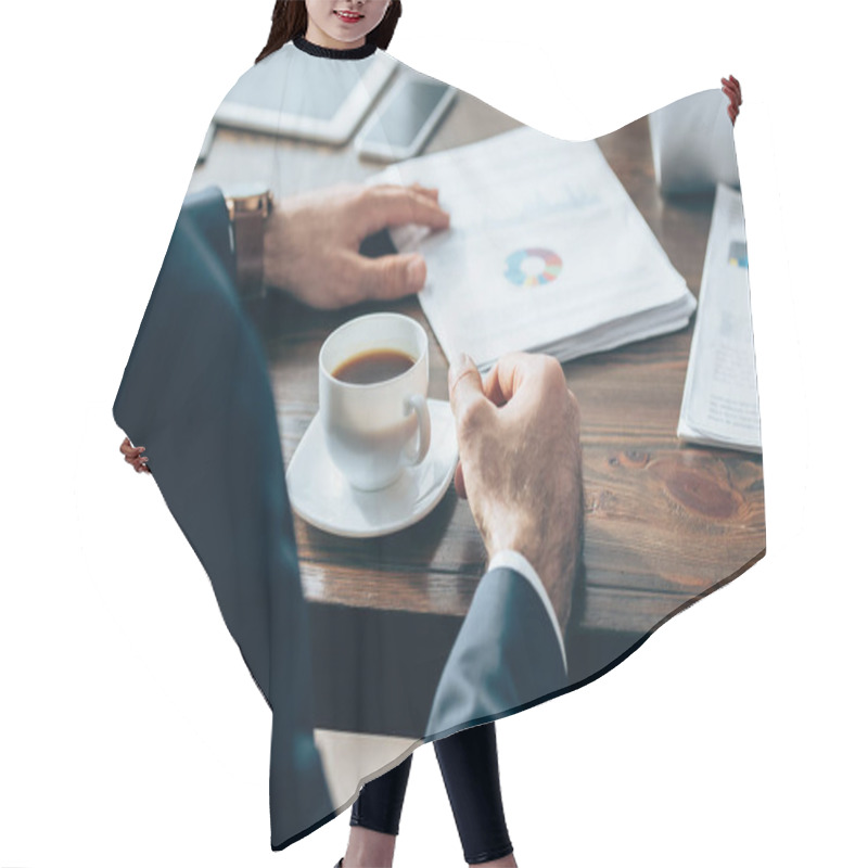 Personality  Cropped View Of Businessman Sitting Near Cup Of Coffee And Papers On Blurred Background On Table  Hair Cutting Cape