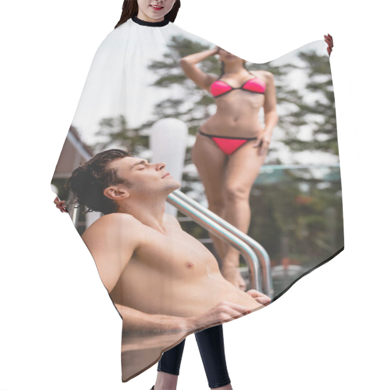 Personality  Selective Focus Of Muscular Man In Swimming Pool Near Woman In Swimsuit  Hair Cutting Cape