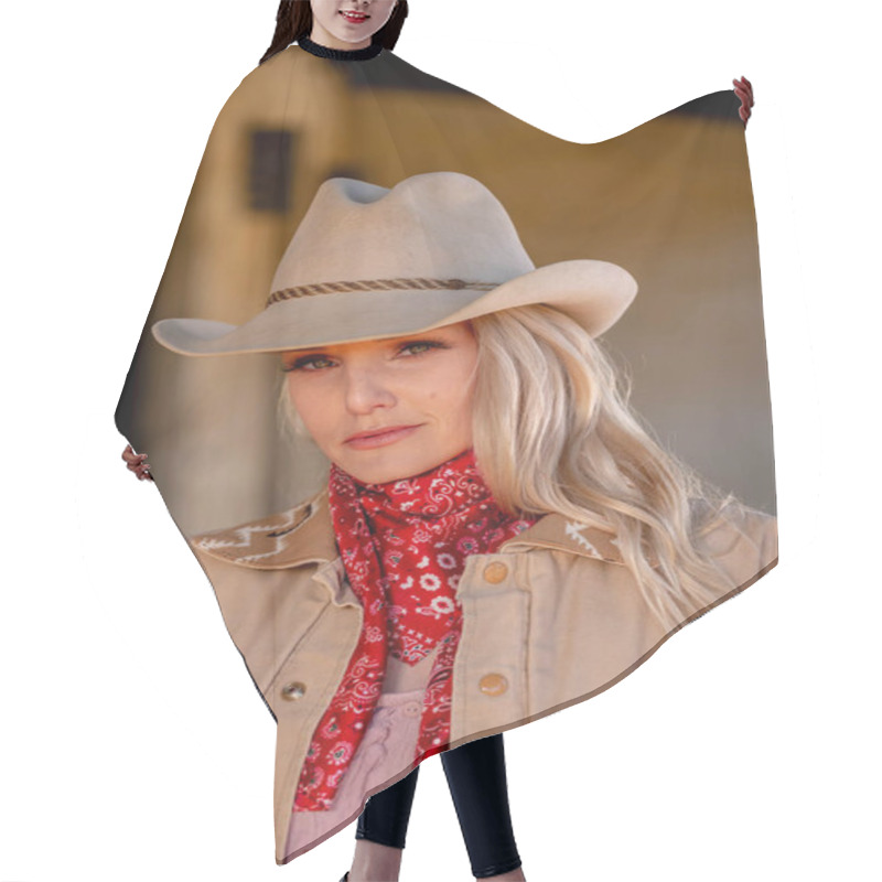 Personality  A Confident, Beautiful Blonde Woman In Classic Cowboy Attire Stands Tall, Posing With A Gleaming Pistol On Her Hip And A Rifle Resting Across Her Shoulder. Her Smile Radiates Energy And Fearless Charm. Hair Cutting Cape