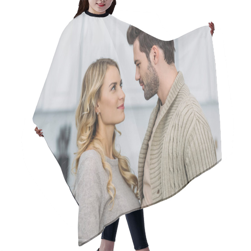 Personality  Portrait Of Girlfriend And Boyfriend Looking At Each Other At Home Hair Cutting Cape