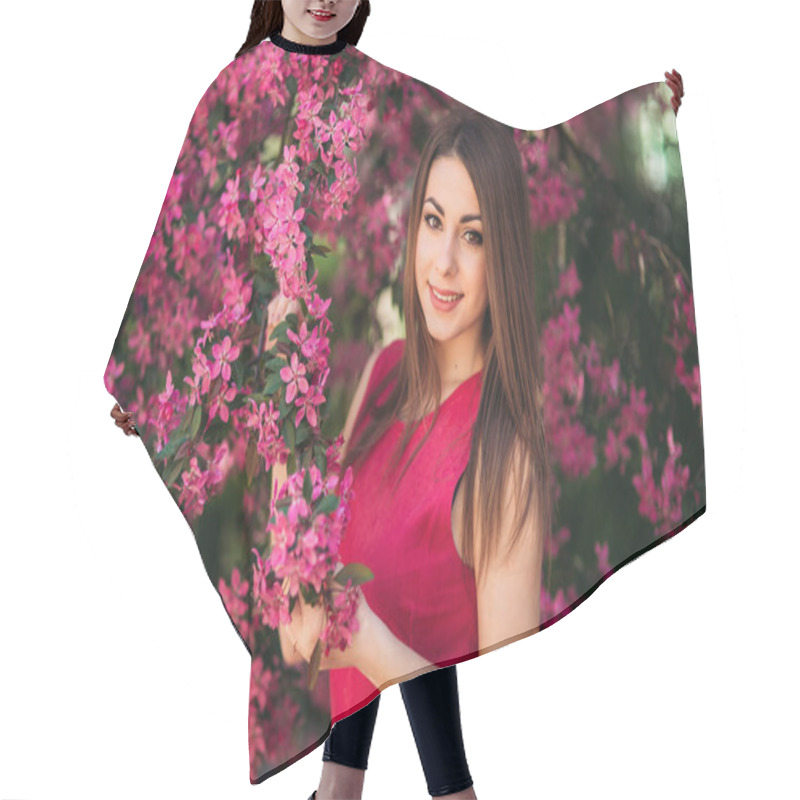 Personality  Young Girl Posing For A Photo. Flowering Pink Trees In The Background. Spring. Sakura Hair Cutting Cape