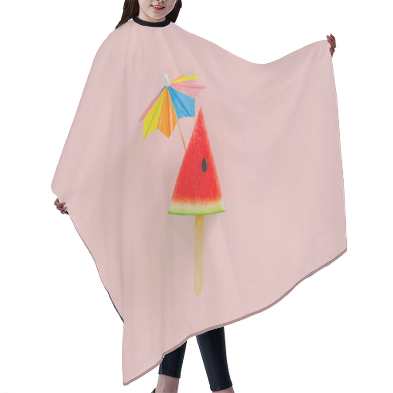 Personality  Red Slice Watermelon Design As Ice Cream With Stick That Have Cocktail Umbrella On Top On Pink Background. Minimal Summer Fruit Concept. Hair Cutting Cape