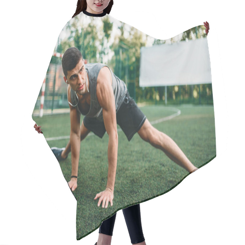 Personality  Male Athlete On Outdoor Fitness Workout. Sportsman Sits On Grass And Doing Stretching Exercise Hair Cutting Cape