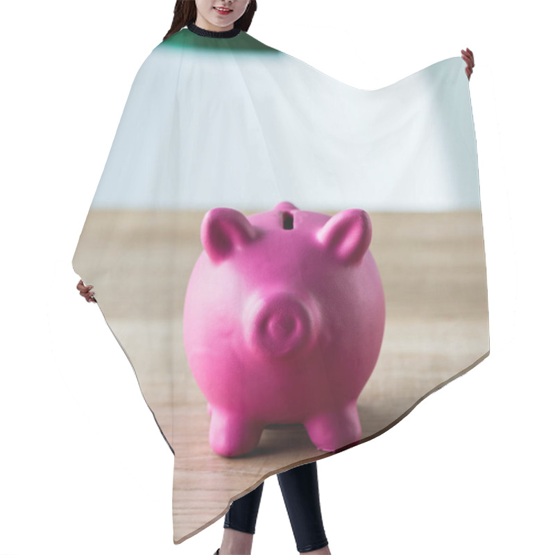 Personality  Close Up Of Pink Piggy Bank On Wooden Desk In Office  Hair Cutting Cape