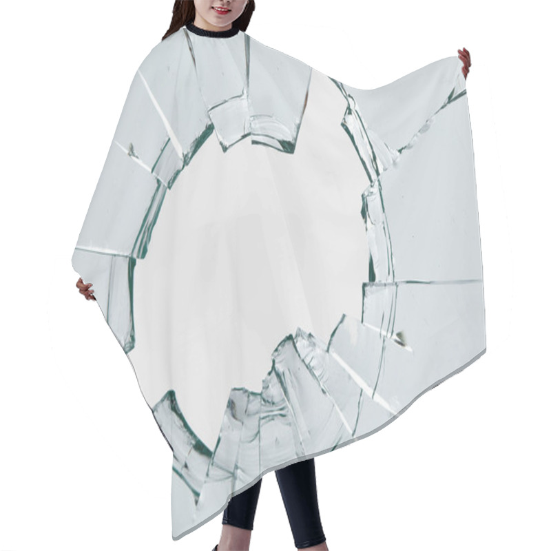 Personality  Cracks On The Glass On A White Background. Broken Window. Hair Cutting Cape