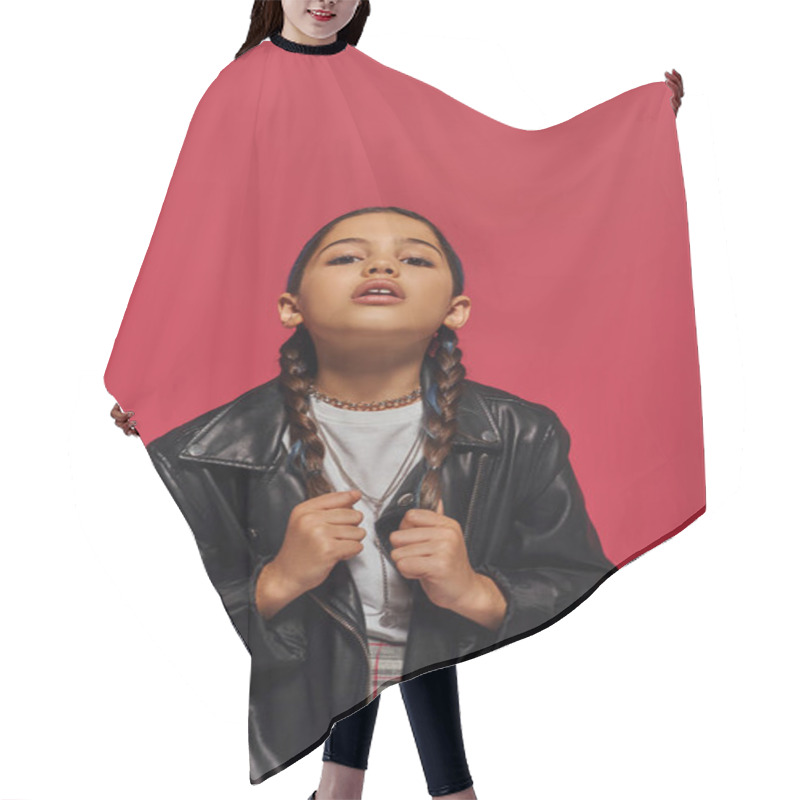 Personality  Portrait Of Fashionable Preteen Girl Touching Hair While Posing In Modern Leather Jacket And Looking At Camera And Standing Isolated On Red, Girl With Cool And Contemporary Look Hair Cutting Cape