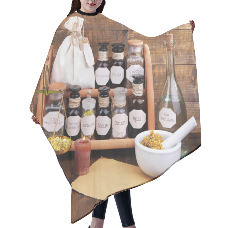 Personality  Composition With Empty Page And Historic Old Pharmacy Bottles With Label   On Wooden Background Hair Cutting Cape