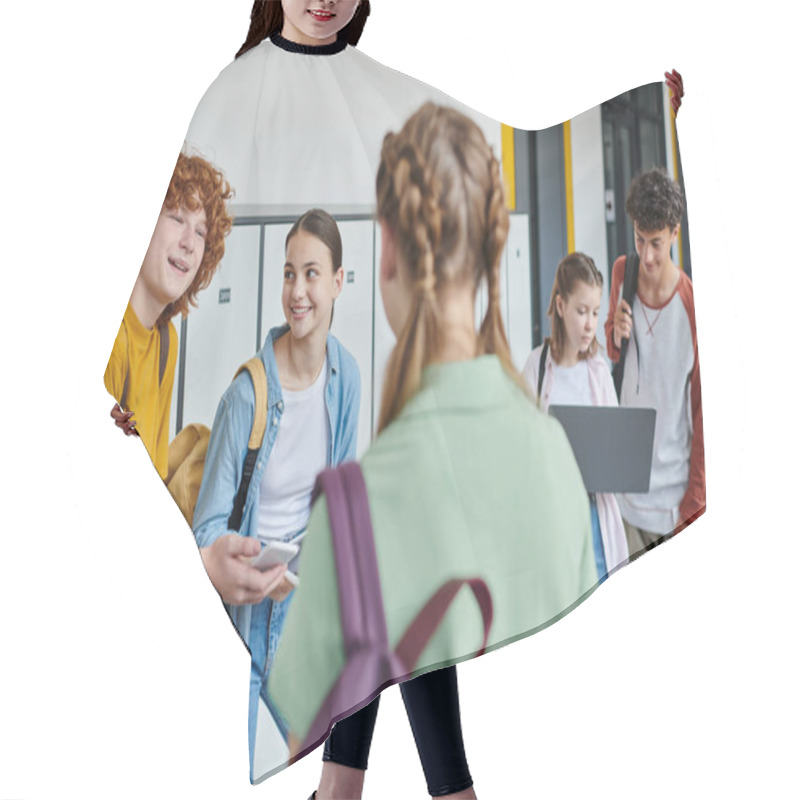 Personality  Happy Redhead Boy Holding Smartphone And Looking At Girl On Blurred Foreground, Teen Students Hair Cutting Cape