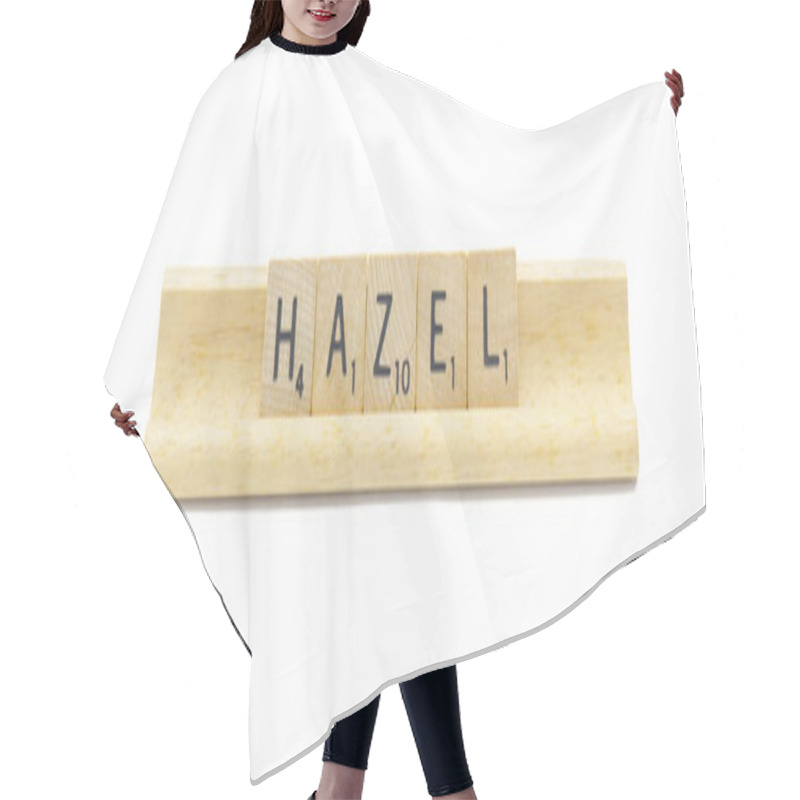 Personality  Concept Of Popular Newborn Baby Girl First Name Of HAZEL Made With Square Wooden Tile English Alphabet Letters With Natural Color And Grain On A Wood Rack Holder Isolated On White Background Hair Cutting Cape