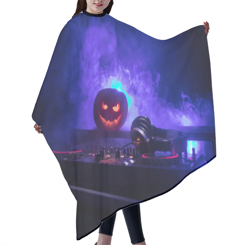 Personality  Halloween Pumpkin On A Dj Table With Headphones On Dark Background With Copy Space. Happy Halloween Festival Decorations And Music Concept. Empty Space. Selective Focus Hair Cutting Cape