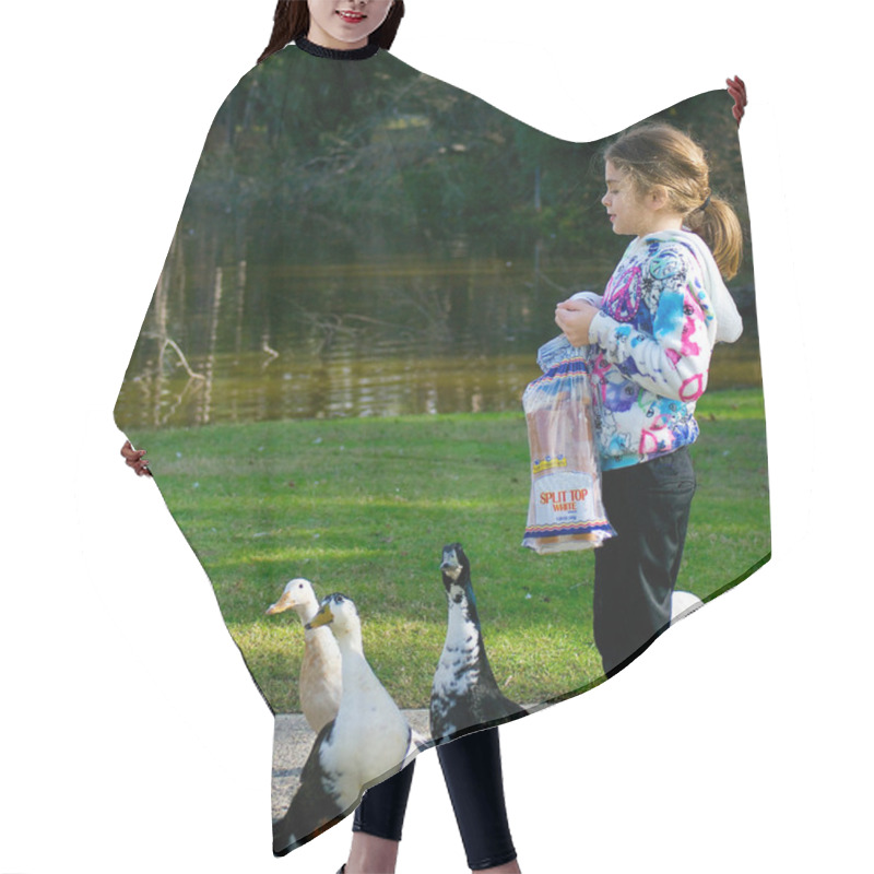 Personality  Young Girl Feeding Ducks. Pekin Duck Makes A Nice Catch Of A Piece Of Bread. Hair Cutting Cape