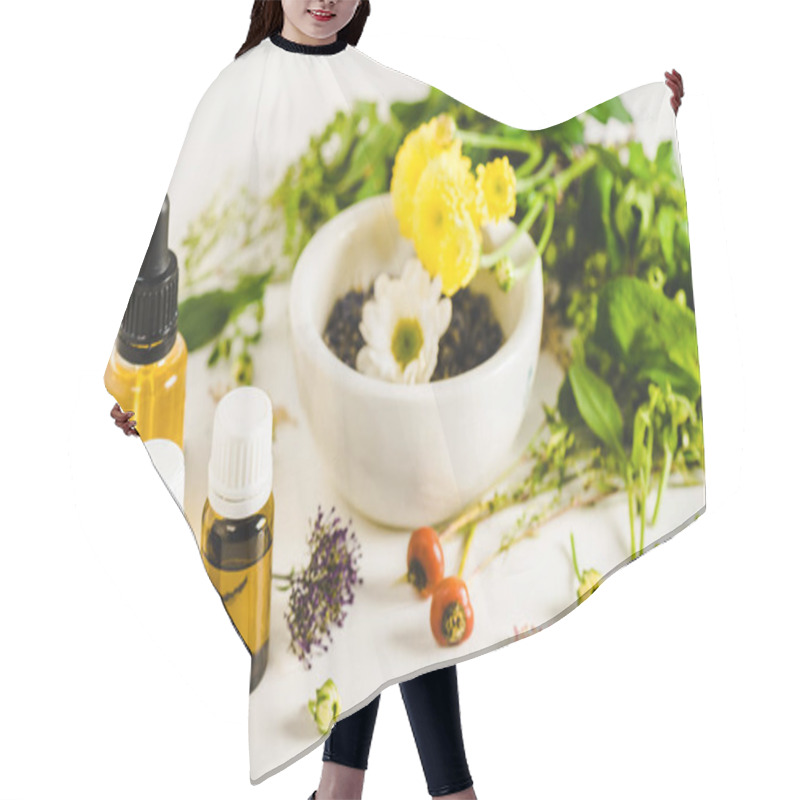 Personality  Bottles Of Essential Oils And Herbs On White Surface, Alternative Medicine Concept Hair Cutting Cape