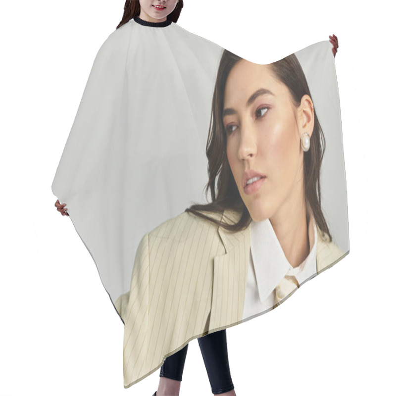 Personality  A Confident Young Woman Poses In A Chic, Neutral Outfit With Stylish Accessories. Hair Cutting Cape