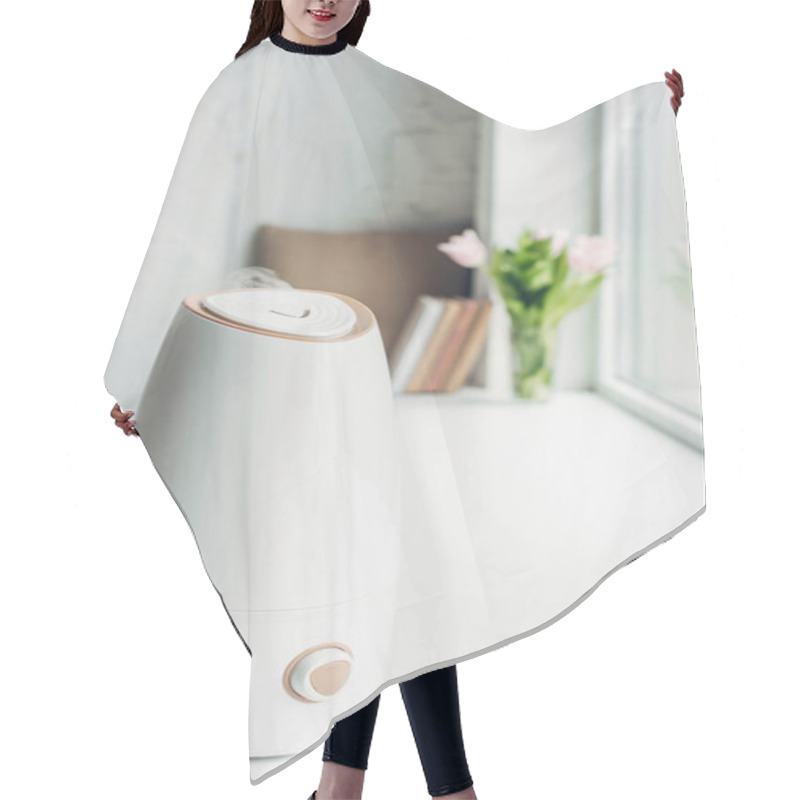 Personality  White Ultrasonic Purifier Standing On Windowsill With Books And Flowers  Hair Cutting Cape