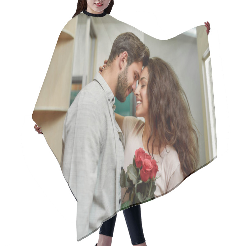 Personality  In Love. Handsome Caucasian Man Bringing Flowers To His Girlfriend. Happy Couple Hugging While Standing Indoors Hair Cutting Cape