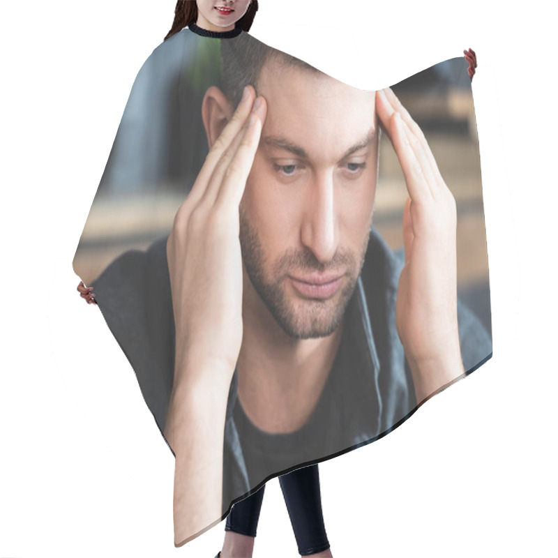 Personality  Handsome Man With Headache Touching Head And Looking Down In Apartment  Hair Cutting Cape