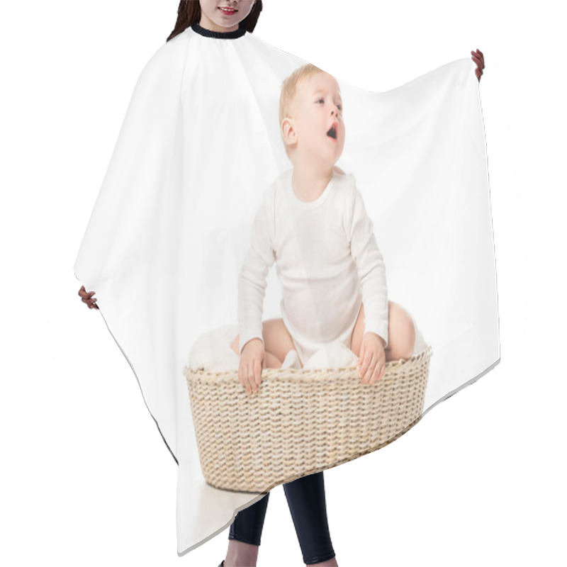 Personality  Cute Boy Looking Away With Open Mouth And Sitting Inside Basket On White Background Hair Cutting Cape