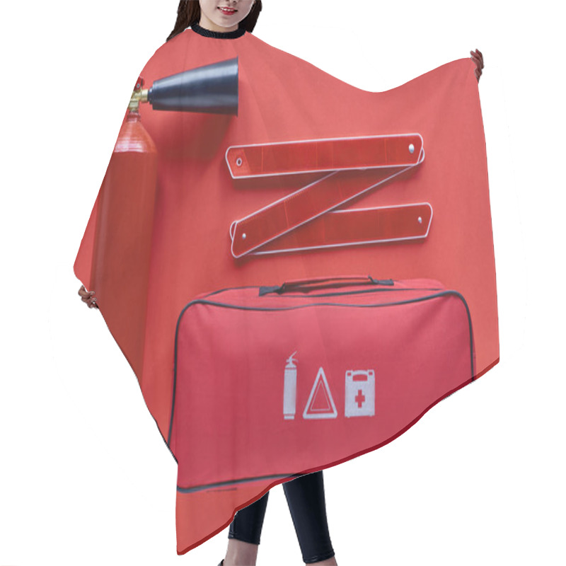 Personality  Flat Lay With Automotive Handbag, Fire Extinguisher And Folded Road Warning Sign On Red Backdrop Hair Cutting Cape