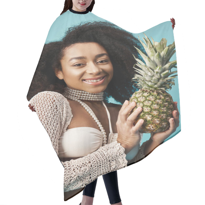 Personality  Stylish Woman In Swimsuit Holding Pineapple Against Blue Backdrop. Hair Cutting Cape