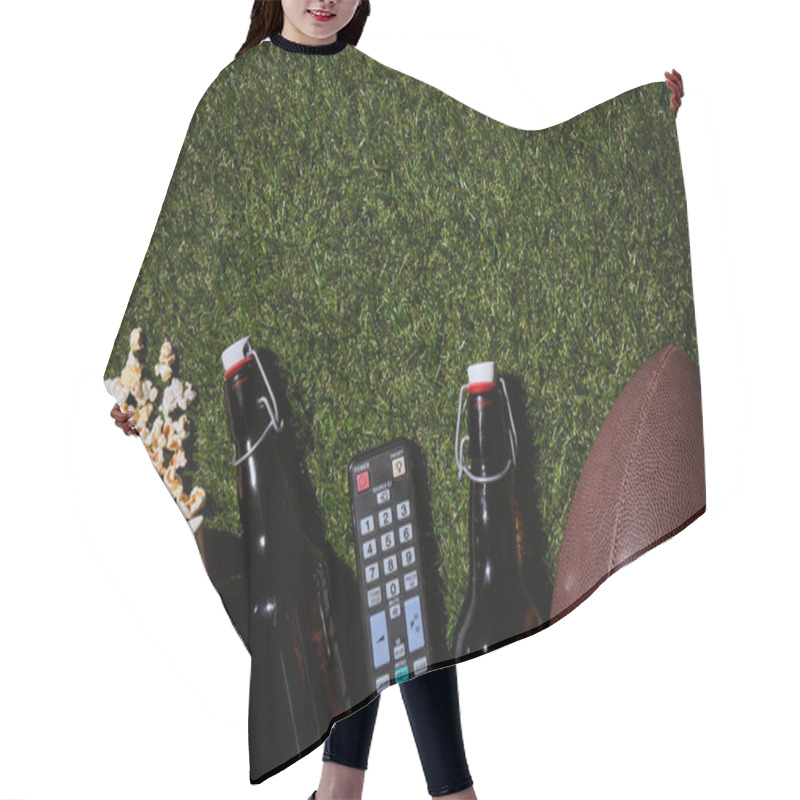 Personality  Flat Lay Of Brown Bottles Near Popcorn, Remote Control And Ball Lying On Grass Hair Cutting Cape