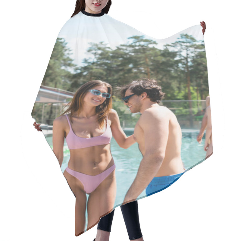 Personality  Smiling Woman In Swimsuit Standing Near Friend And Swimming Pool  Hair Cutting Cape