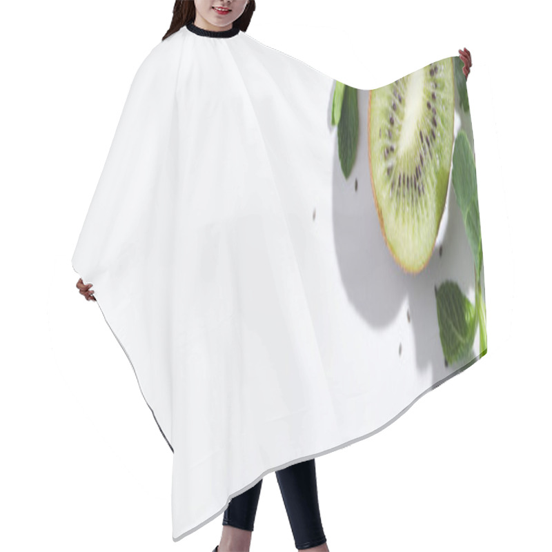 Personality  Horizontal Crop Of Green Peppermint Near Fresh Kiwi Fruit And Black Seeds On White Hair Cutting Cape