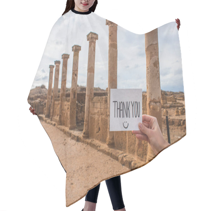 Personality  Cropped View Of Woman Holding Paper With Thank You Lettering Near Columns And Walls Of Ancient House Of Theseus   Hair Cutting Cape