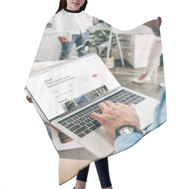 Personality  Cropped Shot Of Young Businessman Using Laptop With Airbnb Website On Screen   Hair Cutting Cape