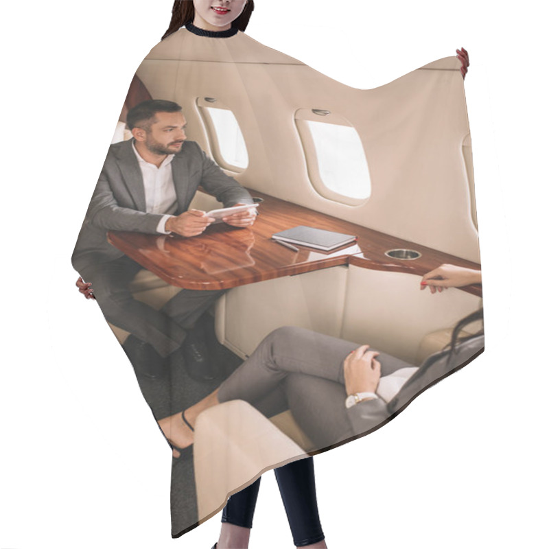 Personality  Cropped View Of Businesswoman Near Handsome Businessman In Plane  Hair Cutting Cape