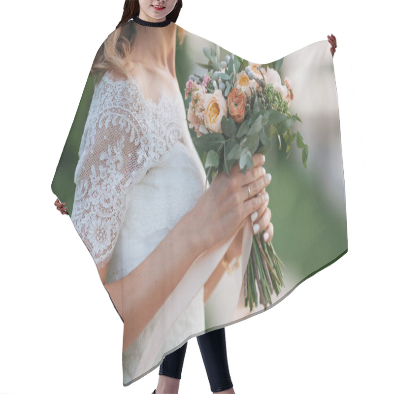 Personality  Wedding. The Bride In A Dress Standing In A Green Garden And Hol Hair Cutting Cape