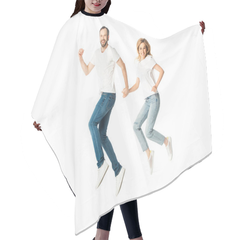 Personality  Happy Adult Couple In White T-shirts Holding Hands While Jumping Isolated On White Hair Cutting Cape