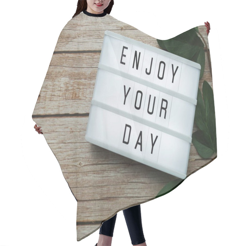 Personality  Enjoy Your Day Text On Lightbox On Wooden Background Hair Cutting Cape