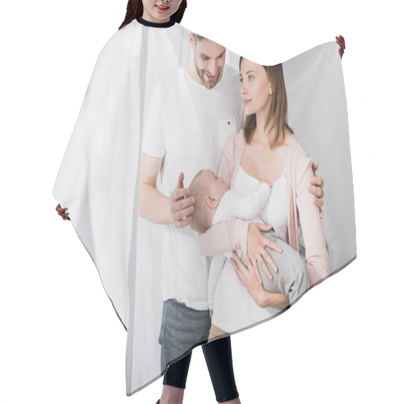 Personality  Caring Woman Holding In Arms Infant Boy Near Husband  Hair Cutting Cape