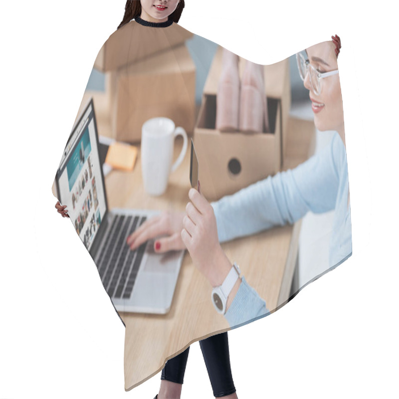 Personality  Selective Focus Of Woman With Credit Card In Hand Looking At Laptop Screen At Table Hair Cutting Cape