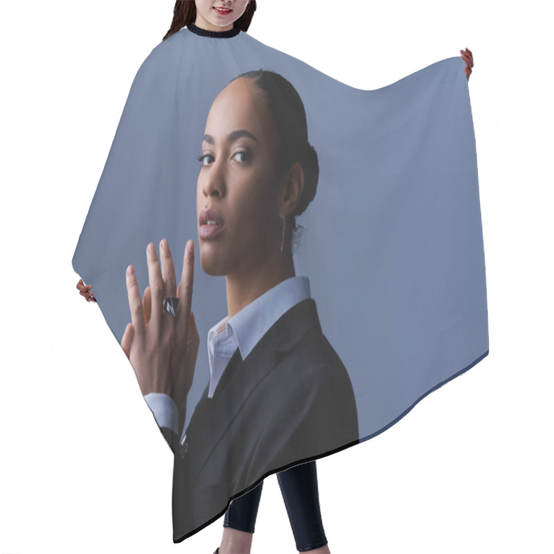 Personality  A Young African American Woman In A Business Suit, Calmly Holding Her Hands Together. Hair Cutting Cape