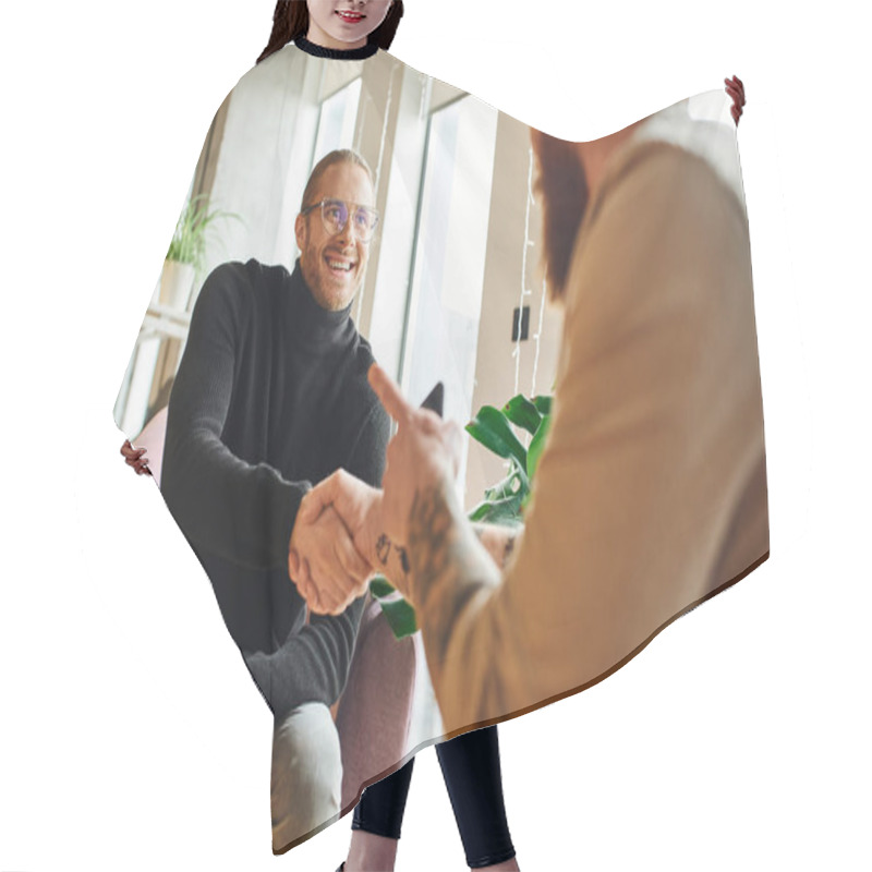 Personality  Happy Entrepreneur In Eyeglasses And Black Turtleneck Shaking Hands And Closing Deal With Tattooed Businessman Pointing With Finger On Blurred Foreground, Successful Partnership Concept Hair Cutting Cape