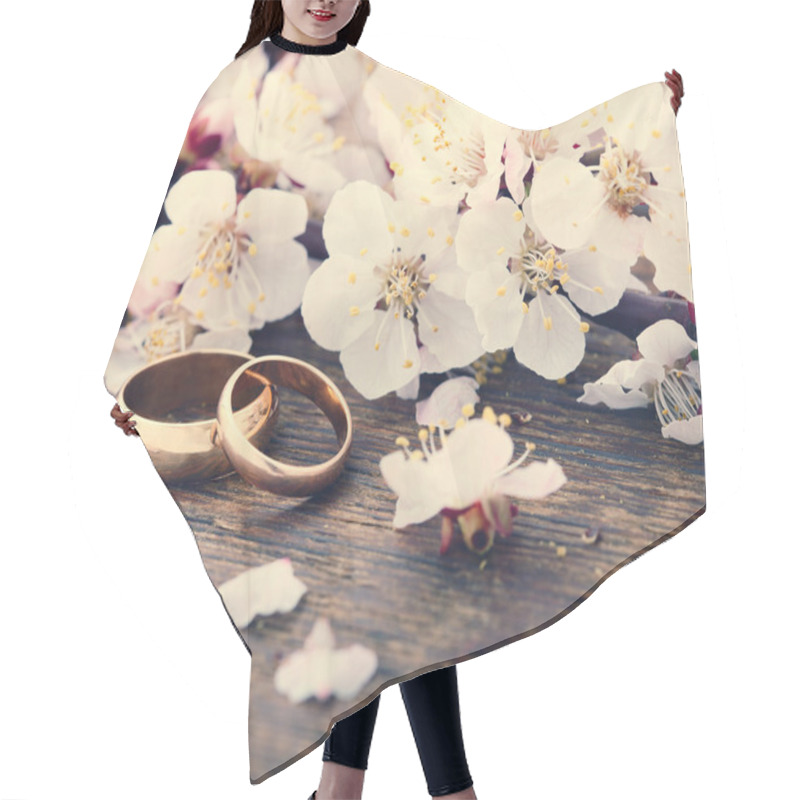 Personality  Wedding Rings. Spring. Flowering Branch On Wooden Surface.  Hair Cutting Cape