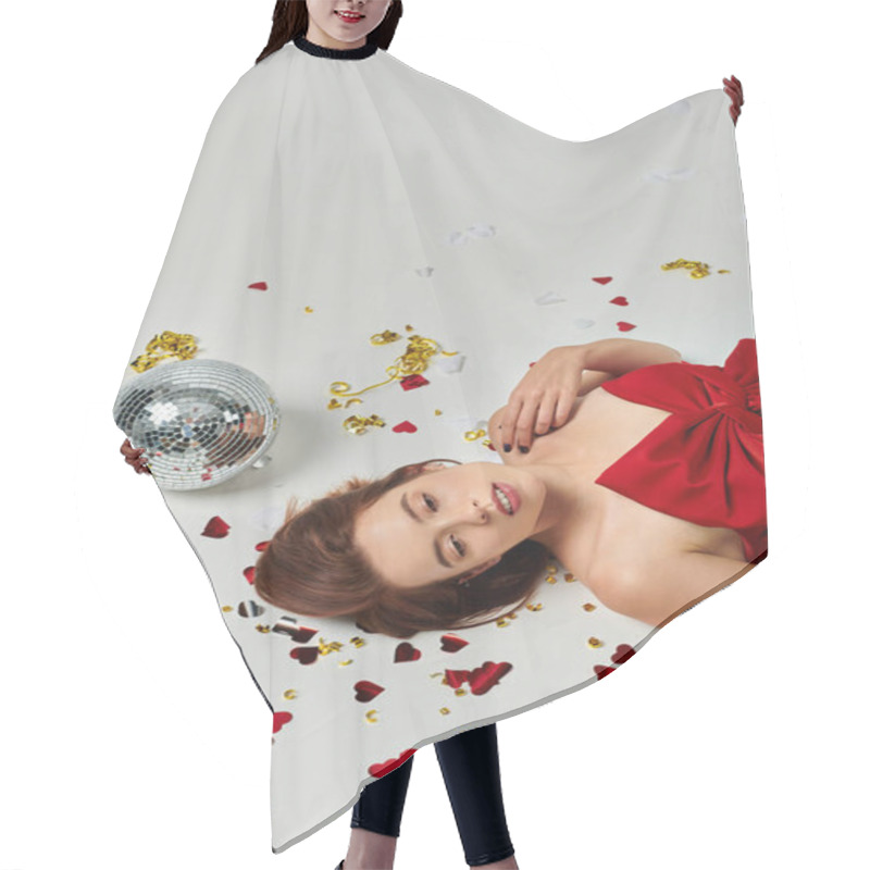 Personality  New Year Party, Brunette Young Woman Lying On Floor Near Confetti And Disco Ball On Grey Backdrop Hair Cutting Cape