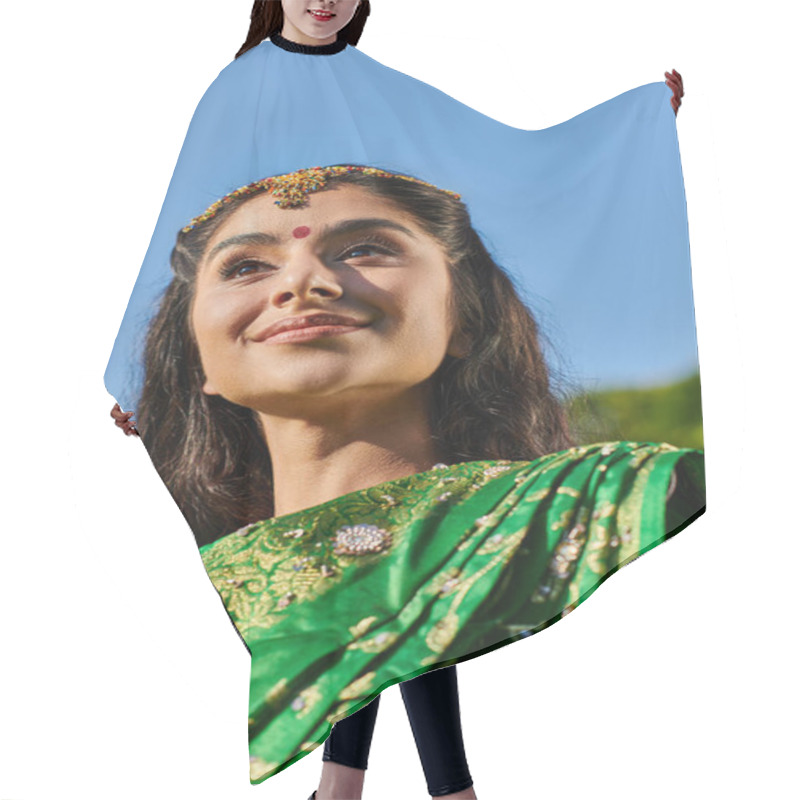 Personality  Low Angle View Of Cheerful Indian Woman With Bindi And Sari Standing With Sky On Background Hair Cutting Cape