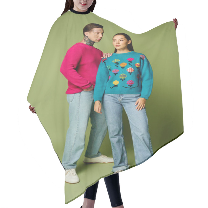 Personality  A Stylish Young Couple Stands Together, Showcasing Vibrant Knitwear While Smiling Warmly. Hair Cutting Cape