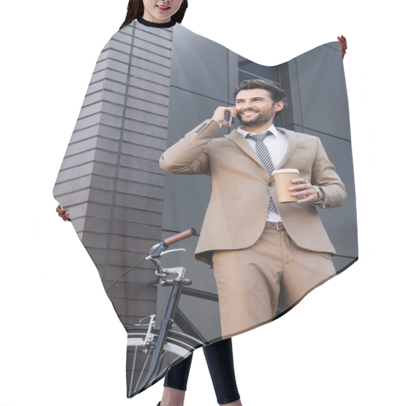 Personality  Low Angle View Of Cheerful Businessman Talking On Smartphone And Holding Paper Cup Near Bicycle And Building  Hair Cutting Cape