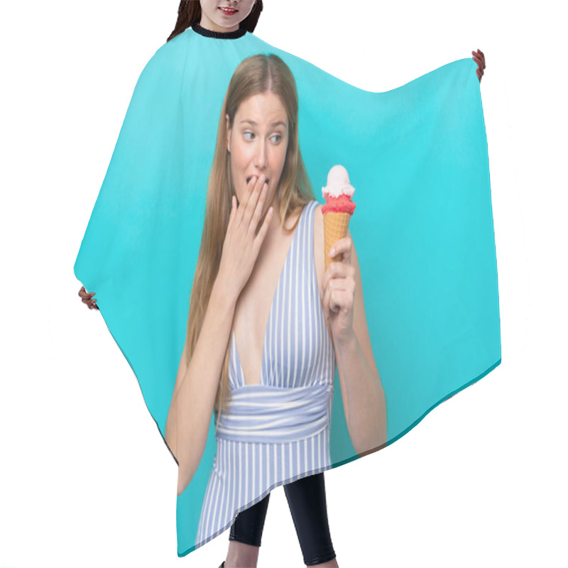 Personality  Young Caucasian Woman In Swimsuit Eating Ice Cream Isolated On Blue Background With Surprise And Shocked Facial Expression Hair Cutting Cape