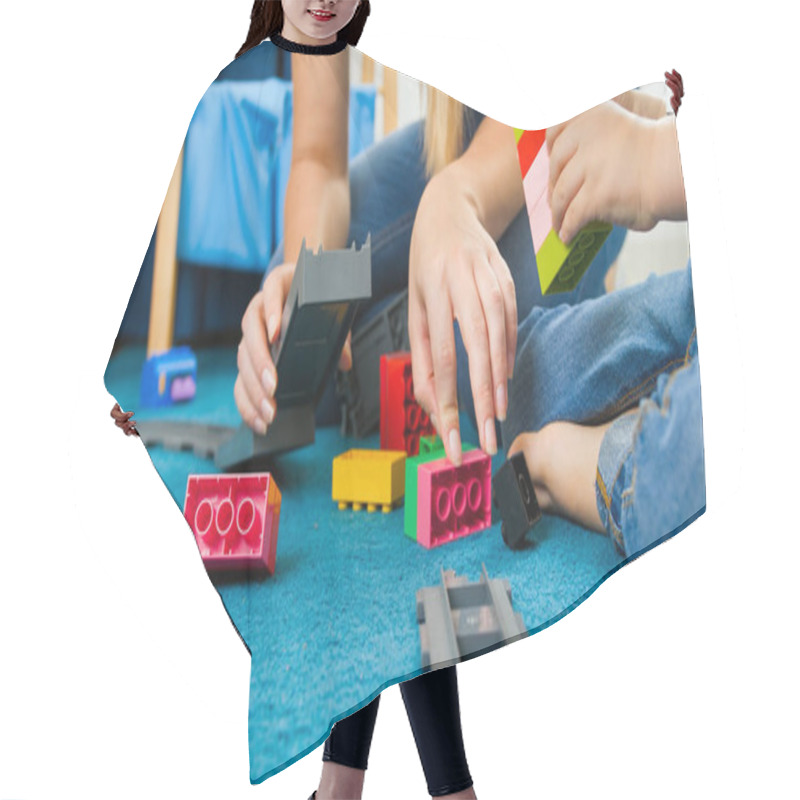 Personality  Closeup Image Of Young Caring Mother Helping Her Son Building Toy Railroad Hair Cutting Cape