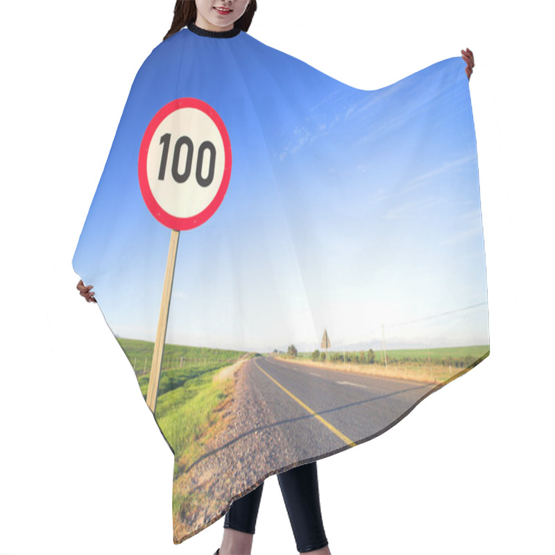 Personality  Warning Sign Or Road Sign For The Maximum Speed Limit Next To An Empty Road On A Sunny Summer Day. Hair Cutting Cape