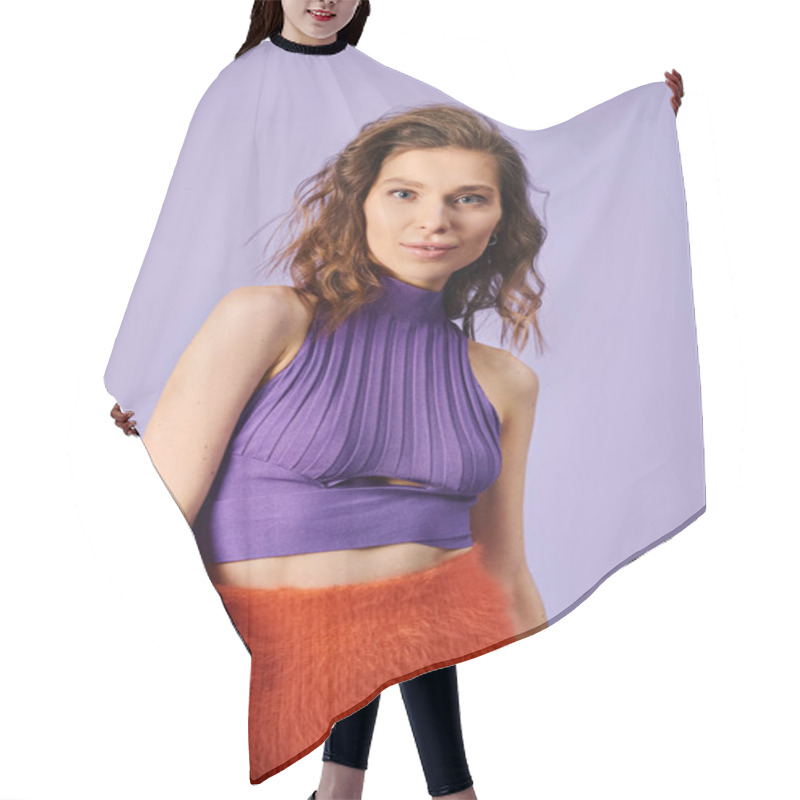 Personality  A Stylish Young Woman Stands Out In A Purple Top And Orange Skirt Against A Bold Purple Background. Hair Cutting Cape