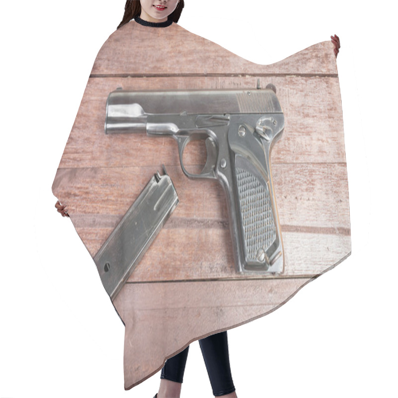 Personality  Semi-automatic 9mm Gun Isolated On Wooden Background Hair Cutting Cape