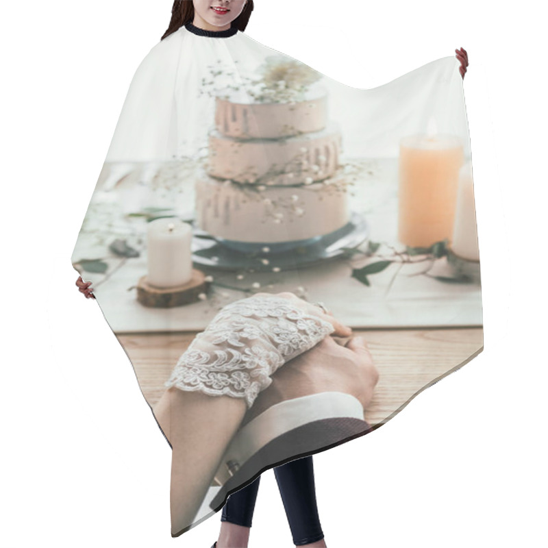 Personality  Partial View Of Newlyweds Holding Hands While Sitting At Served Table With Wedding Cake, Rustic Wedding Concept Hair Cutting Cape