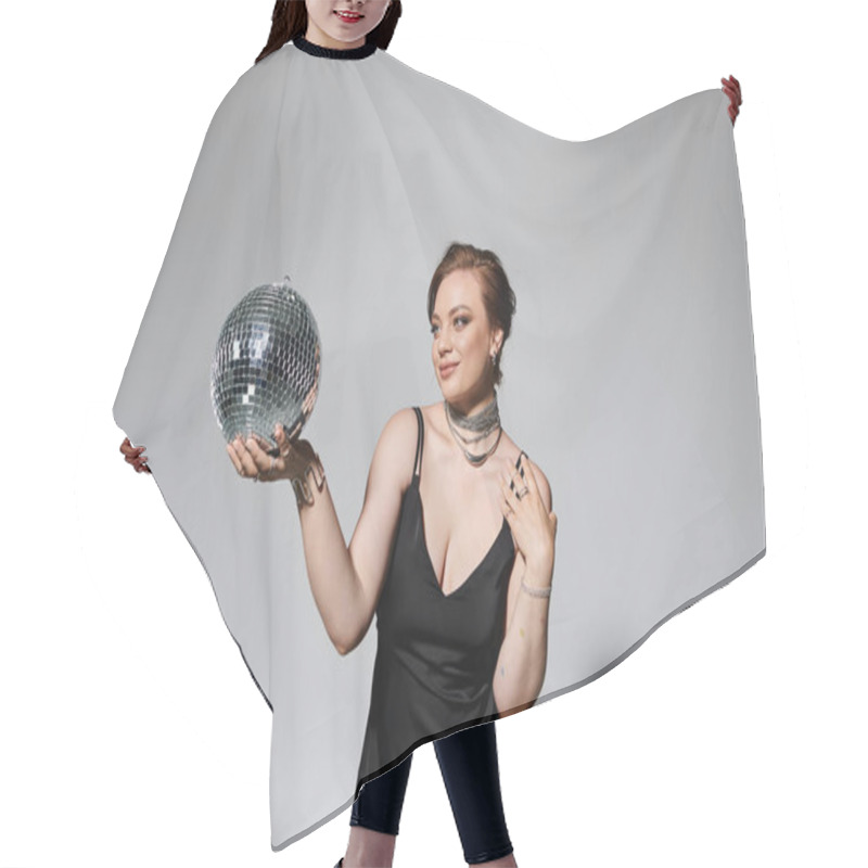 Personality  The Young Woman Gracefully Showcases A Disco Ball While Dressed In Elegant Evening Wear. Hair Cutting Cape